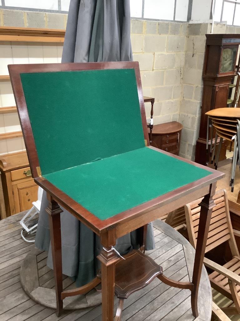 An Edwardian mahogany and satinwood banded swivel top card table, width 60cm, depth 40cm, height 74cm